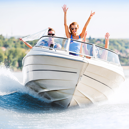 Family enjoying their boat on a lake.