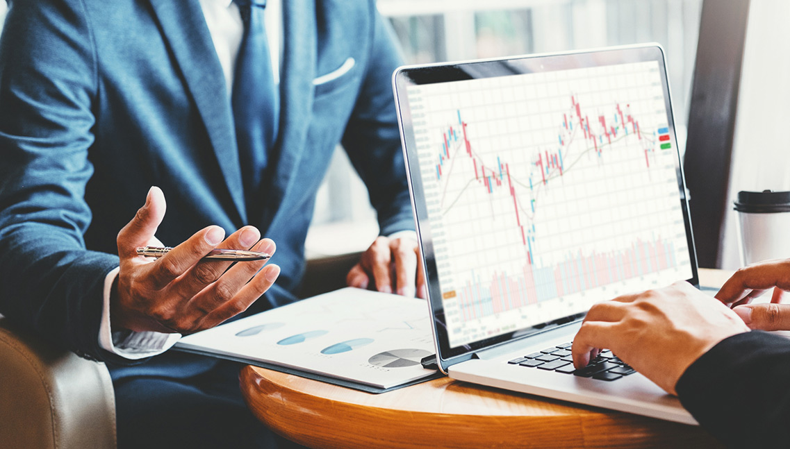 Business people meeting using a laptop.