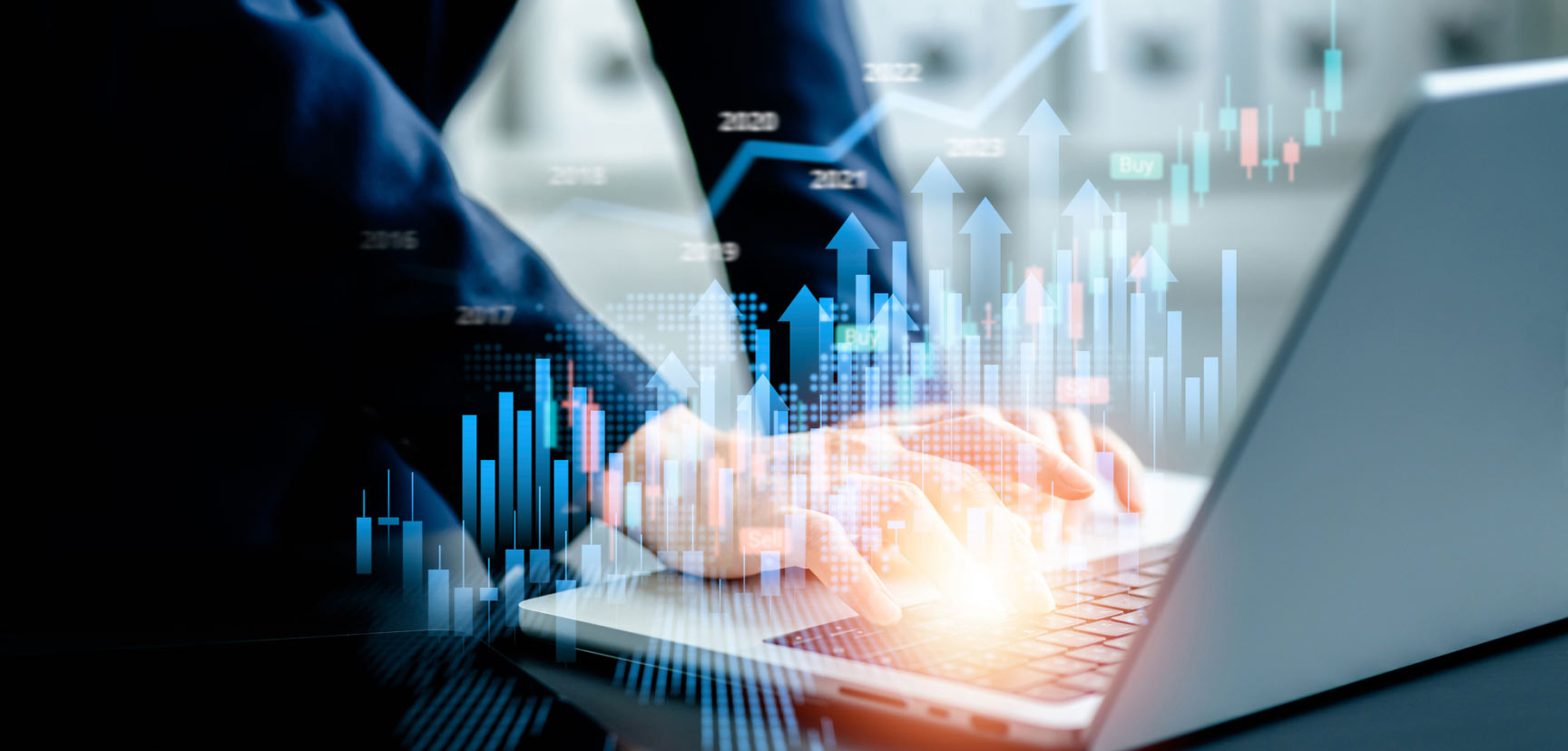 Abstract image of graphs over a laptop.