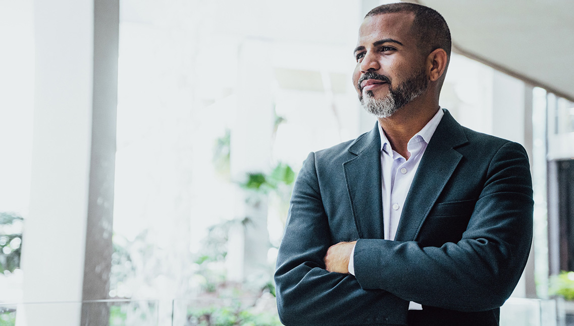 Business person looking out the window.